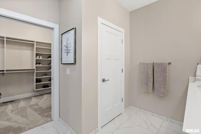 4048 Meadowlark Ct, Bettendorf, IA 52722 - bathroom featuring visible vents, a closet, marble finish floor, and baseboards