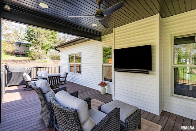 4048 Meadowlark Ct, Bettendorf, IA 52722 - wooden deck featuring ceiling fan and an outdoor living space