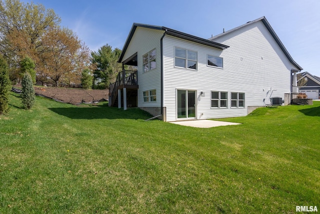 4048 Meadowlark Ct, Bettendorf, IA 52722 - back of property with a patio, a deck, a yard, and central AC