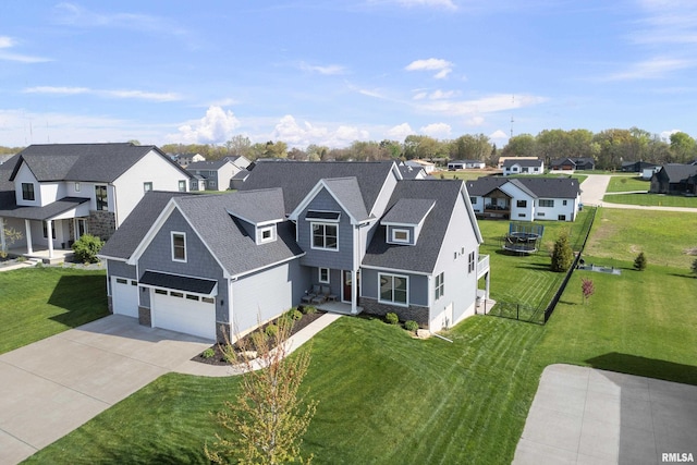 view of front facade with a residential view, concrete driveway, stone siding, and a front lawn