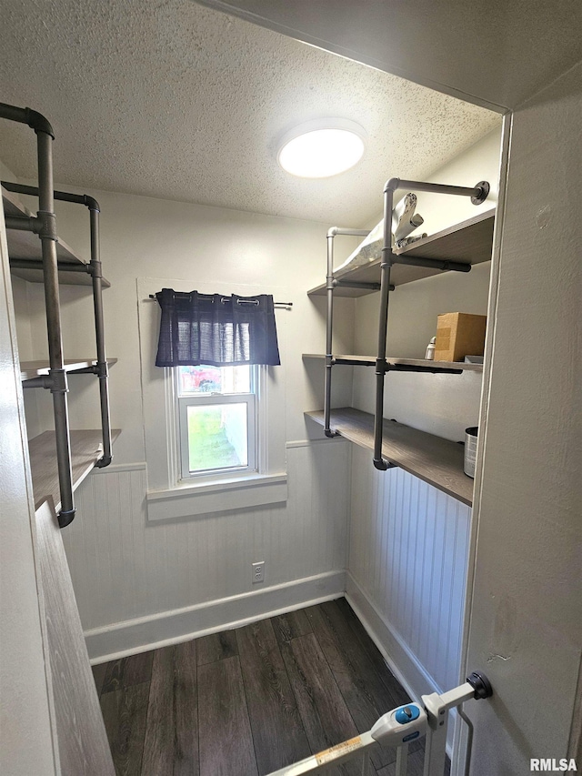 1731 W 5th St, Davenport, IA 52802 - walk in closet featuring dark wood-style floors