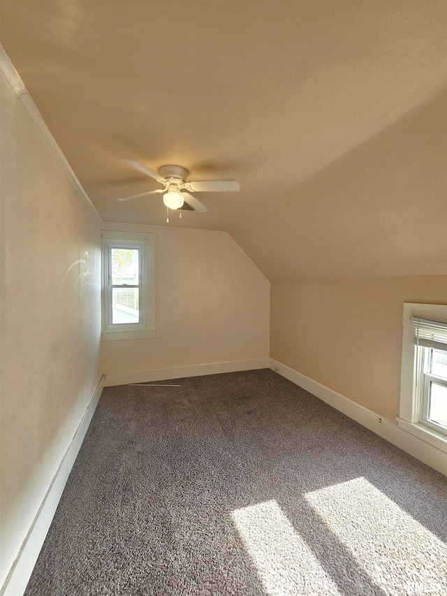 1731 W 5th St, Davenport, IA 52802 - bonus room with carpet flooring, a ceiling fan, lofted ceiling, and baseboards