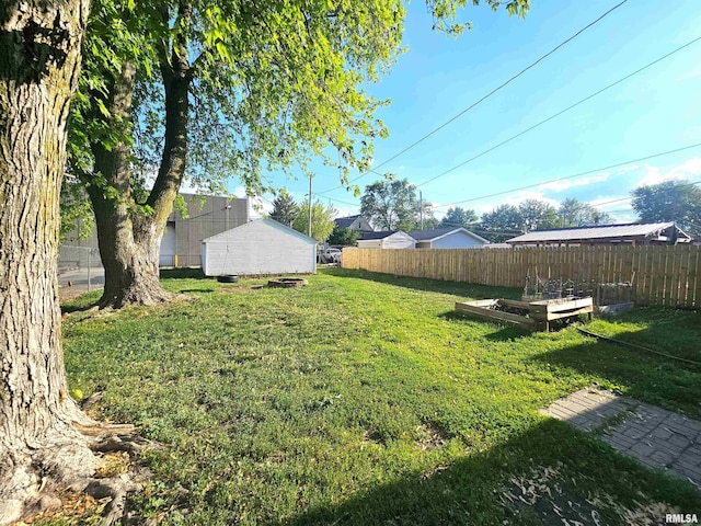 1731 W 5th St, Davenport, IA 52802 - view of yard featuring a vegetable garden