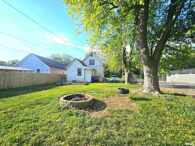 1731 W 5th St, Davenport, IA 52802 - view of yard featuring an outdoor fire pit