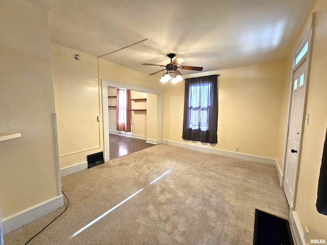 1731 W 5th St, Davenport, IA 52802 - unfurnished room featuring carpet, ceiling fan, healthy amount of natural light, and baseboards