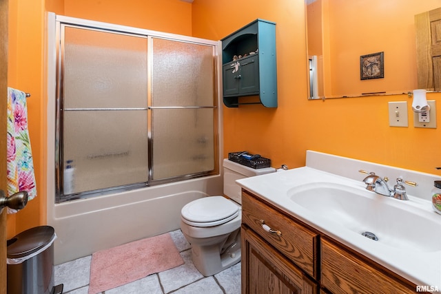 full bath with toilet, tile patterned flooring, vanity, and combined bath / shower with glass door