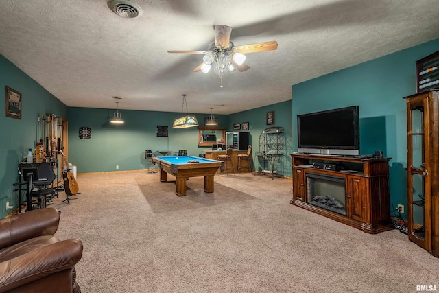 rec room featuring pool table, carpet, ceiling fan, visible vents, and a textured ceiling