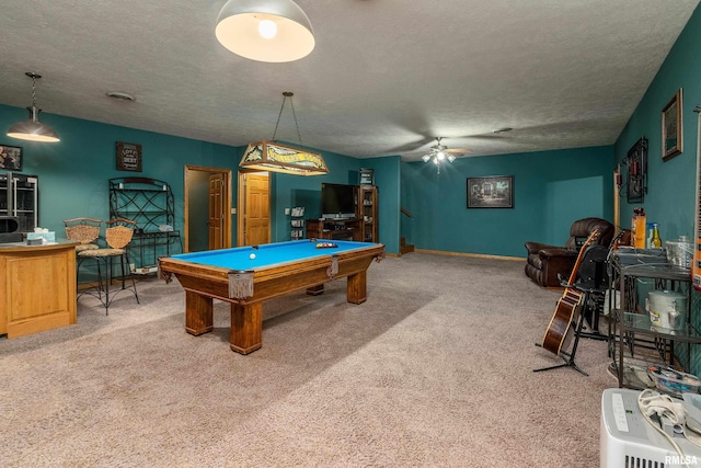 rec room with ceiling fan, a textured ceiling, carpet, and pool table