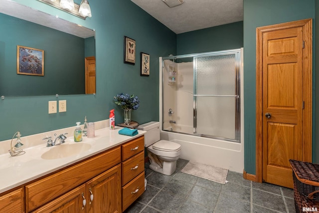 full bathroom featuring bath / shower combo with glass door, toilet, and vanity