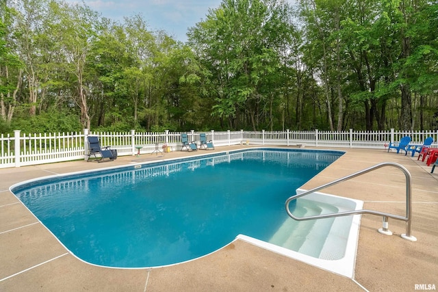 view of swimming pool with fence, a patio area, and a fenced in pool