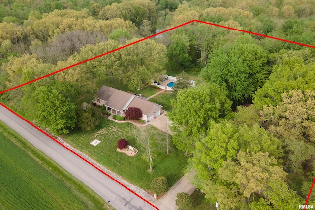 bird's eye view featuring a forest view