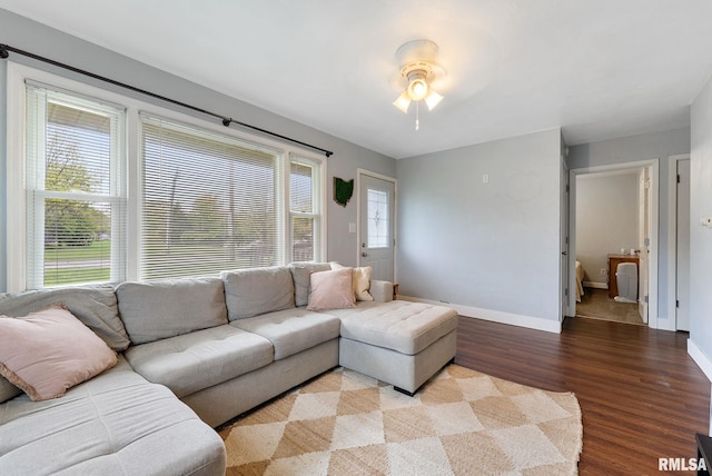 1925 N Fairmount St, Davenport, IA 52804 - living room featuring a ceiling fan, baseboards, and wood finished floors