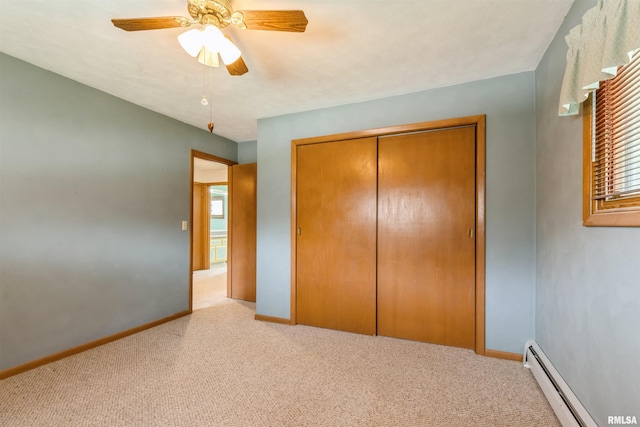 12323 Niabi Zoo Rd, Coal Valley, IL 61240 - unfurnished bedroom with a closet, carpet flooring, baseboard heating, and baseboards