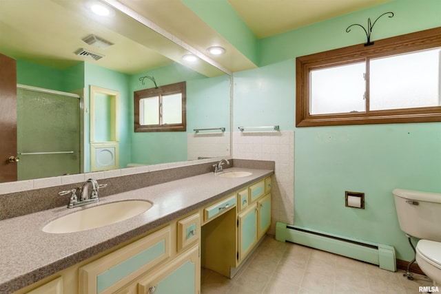 12323 Niabi Zoo Rd, Coal Valley, IL 61240 - full bathroom featuring a stall shower, toilet, baseboard heating, and a sink