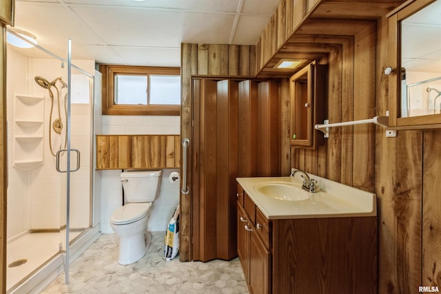 12323 Niabi Zoo Rd, Coal Valley, IL 61240 - bathroom with toilet, a shower stall, wood walls, and vanity