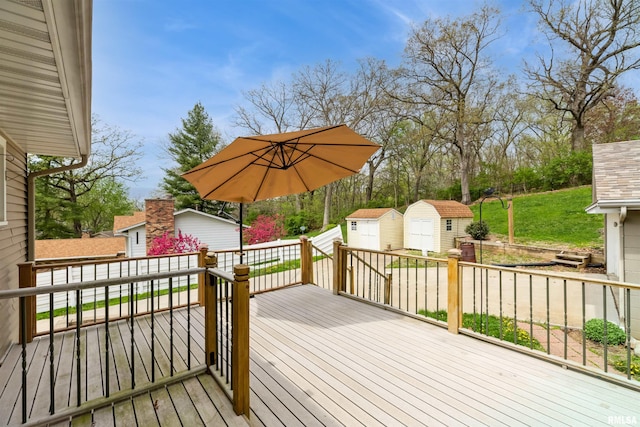 12323 Niabi Zoo Rd, Coal Valley, IL 61240 - wooden terrace featuring an outdoor structure and a storage unit