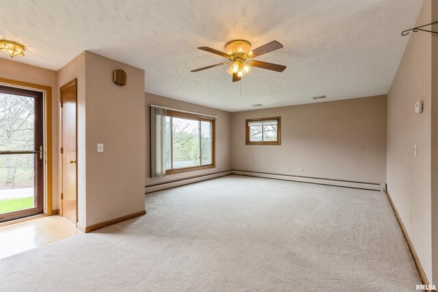 12323 Niabi Zoo Rd, Coal Valley, IL 61240 - spare room with baseboards, visible vents, a ceiling fan, and carpet