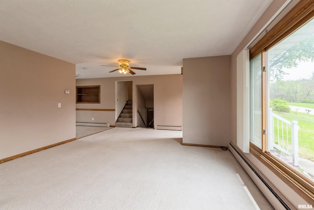 12323 Niabi Zoo Rd, Coal Valley, IL 61240 - empty room with a baseboard heating unit, light carpet, and baseboards