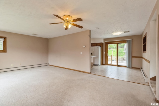 12323 Niabi Zoo Rd, Coal Valley, IL 61240 - unfurnished room featuring visible vents, baseboard heating, light colored carpet, and baseboards