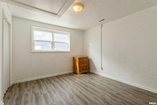 737/739 24th St, East Moline, IL 61244 - unfurnished room with baseboards, visible vents, and wood finished floors