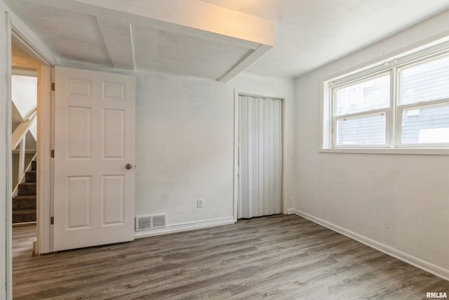 737/739 24th St, East Moline, IL 61244 - empty room with stairway, baseboards, visible vents, and wood finished floors