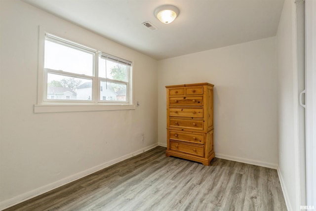 737/739 24th St, East Moline, IL 61244 - bedroom featuring baseboards, light wood finished floors, and visible vents