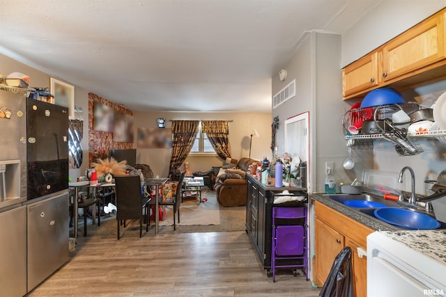737/739 24th St, East Moline, IL 61244 - kitchen with light wood-style floors, open floor plan, visible vents, and a sink