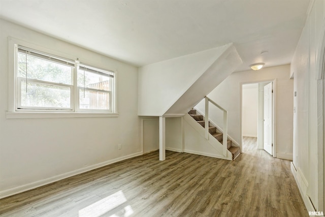 737/739 24th St, East Moline, IL 61244 - additional living space featuring stairway, wood finished floors, and baseboards