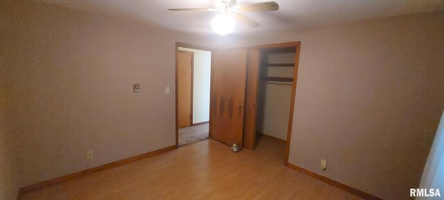 unfurnished bedroom featuring light wood finished floors, a closet, ceiling fan, and baseboards