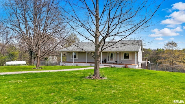 single story home with a porch, a front yard, and fence