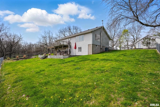 rear view of property with cooling unit, a patio, a deck, and a fenced backyard