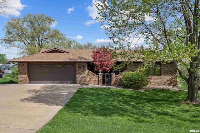 single story home with brick siding, a front lawn, driveway, and an attached garage