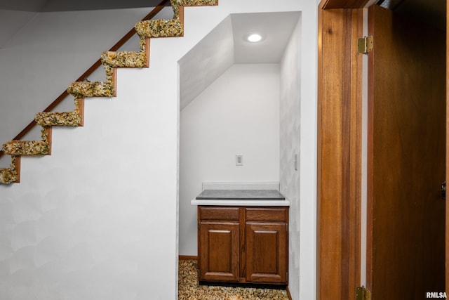 interior space featuring recessed lighting and stairs