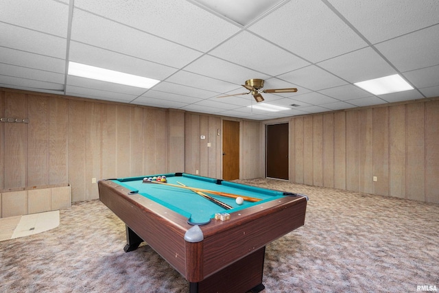 playroom with wooden walls, a paneled ceiling, carpet floors, and pool table