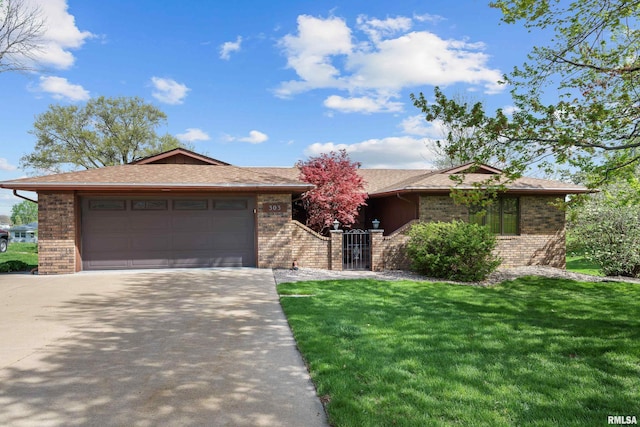 ranch-style home featuring a garage, brick siding, a front lawn, and concrete driveway