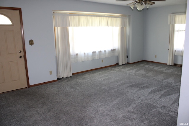 2107 W 38th Pl, Davenport, IA 52806 - carpeted empty room with baseboards and a ceiling fan