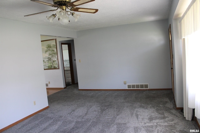 2107 W 38th Pl, Davenport, IA 52806 - spare room featuring baseboards, ceiling fan, carpet, and visible vents