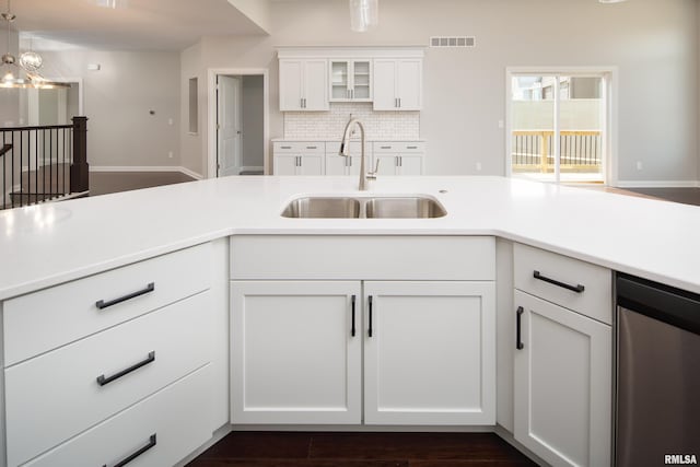 5120 Pandit Dr, Bettendorf, IA 52722 - kitchen with visible vents, light countertops, white cabinetry, and a sink