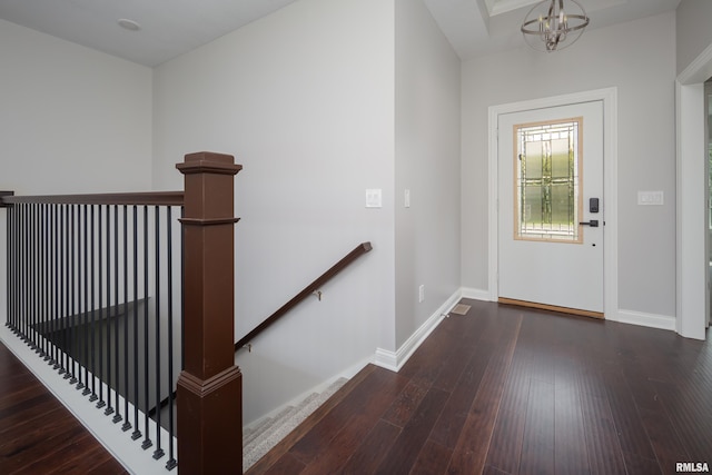 5120 Pandit Dr, Bettendorf, IA 52722 - entrance foyer with baseboards, hardwood / wood-style flooring, and an inviting chandelier