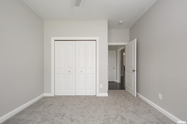 5120 Pandit Dr, Bettendorf, IA 52722 - unfurnished bedroom featuring a closet, carpet flooring, a ceiling fan, and baseboards