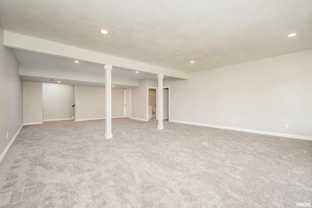 5120 Pandit Dr, Bettendorf, IA 52722 - finished basement featuring baseboards, recessed lighting, carpet floors, and a textured ceiling