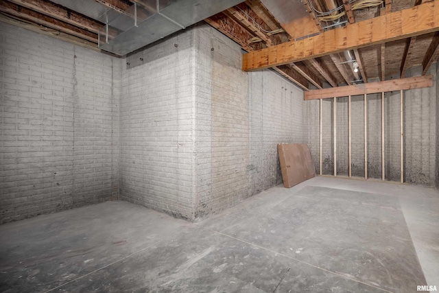 5120 Pandit Dr, Bettendorf, IA 52722 - unfinished below grade area featuring brick wall