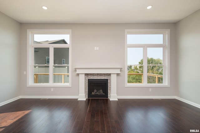 5120 Pandit Dr, Bettendorf, IA 52722 - unfurnished living room featuring recessed lighting, dark wood-style flooring, baseboards, and a fireplace