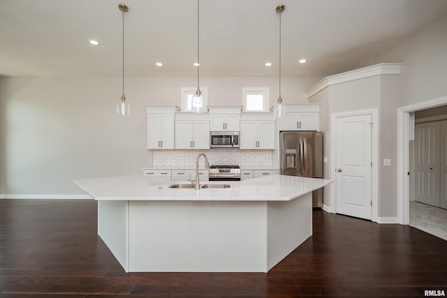 5120 Pandit Dr, Bettendorf, IA 52722 - kitchen featuring a sink, stainless steel appliances, light countertops, a large island, and backsplash