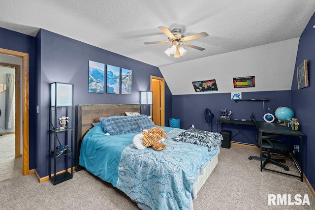 carpeted bedroom with baseboards, a textured ceiling, vaulted ceiling, and ceiling fan