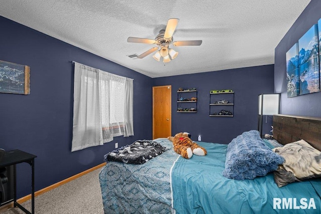 carpeted bedroom with baseboards, a textured ceiling, and ceiling fan