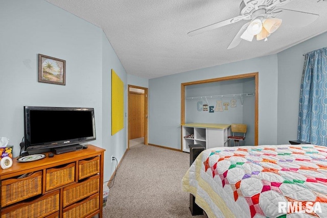 bedroom with ceiling fan, carpet floors, a textured ceiling, baseboards, and a closet