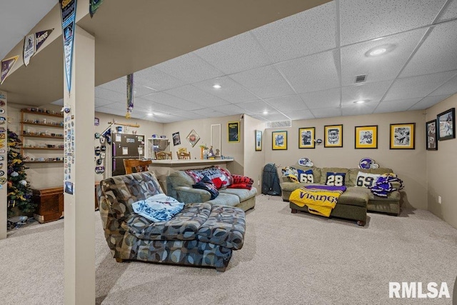 living area with carpet flooring, recessed lighting, and a drop ceiling