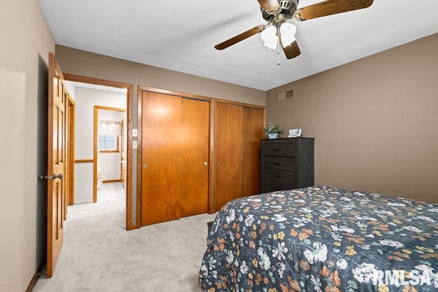 bedroom featuring carpet flooring, visible vents, and ceiling fan