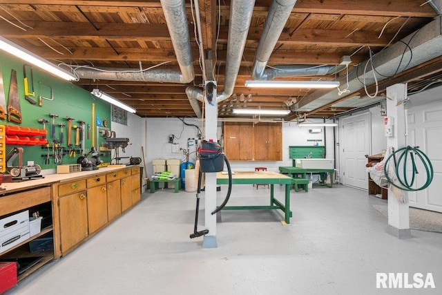 unfinished below grade area featuring a workshop area